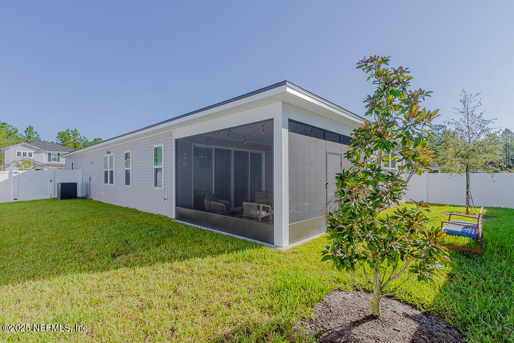 3616 Cunningham Road Orange Park, FL 32065 - Photo 47 of 48 a backyard of a house with lots of green space