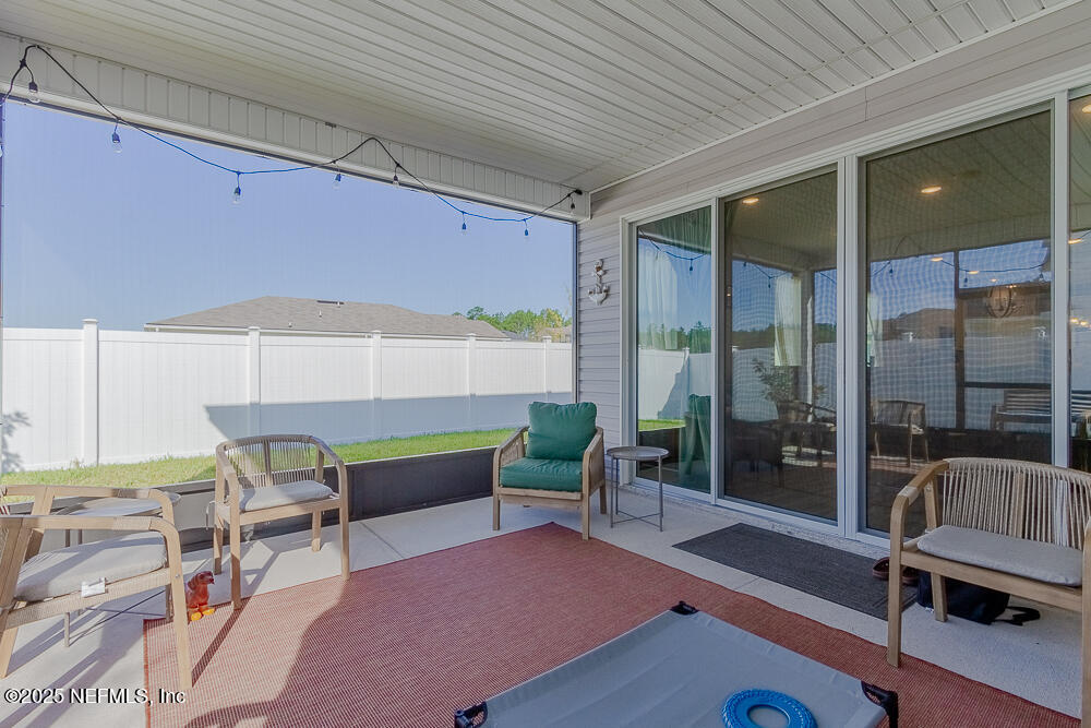 3616 Cunningham Road Orange Park, FL 32065 - Photo 48 of 48 a living room with furniture and a table