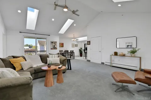 a living room with furniture and a chair