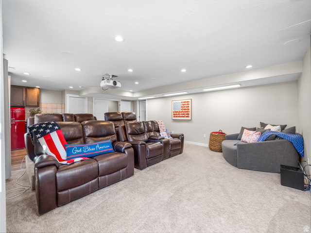 7 Sterling Loop Vineyard, UT 84059 - Photo 30 of 43 Entertainment space featuring recessed lighting, a ceiling-mounted projector, and carpet flooring