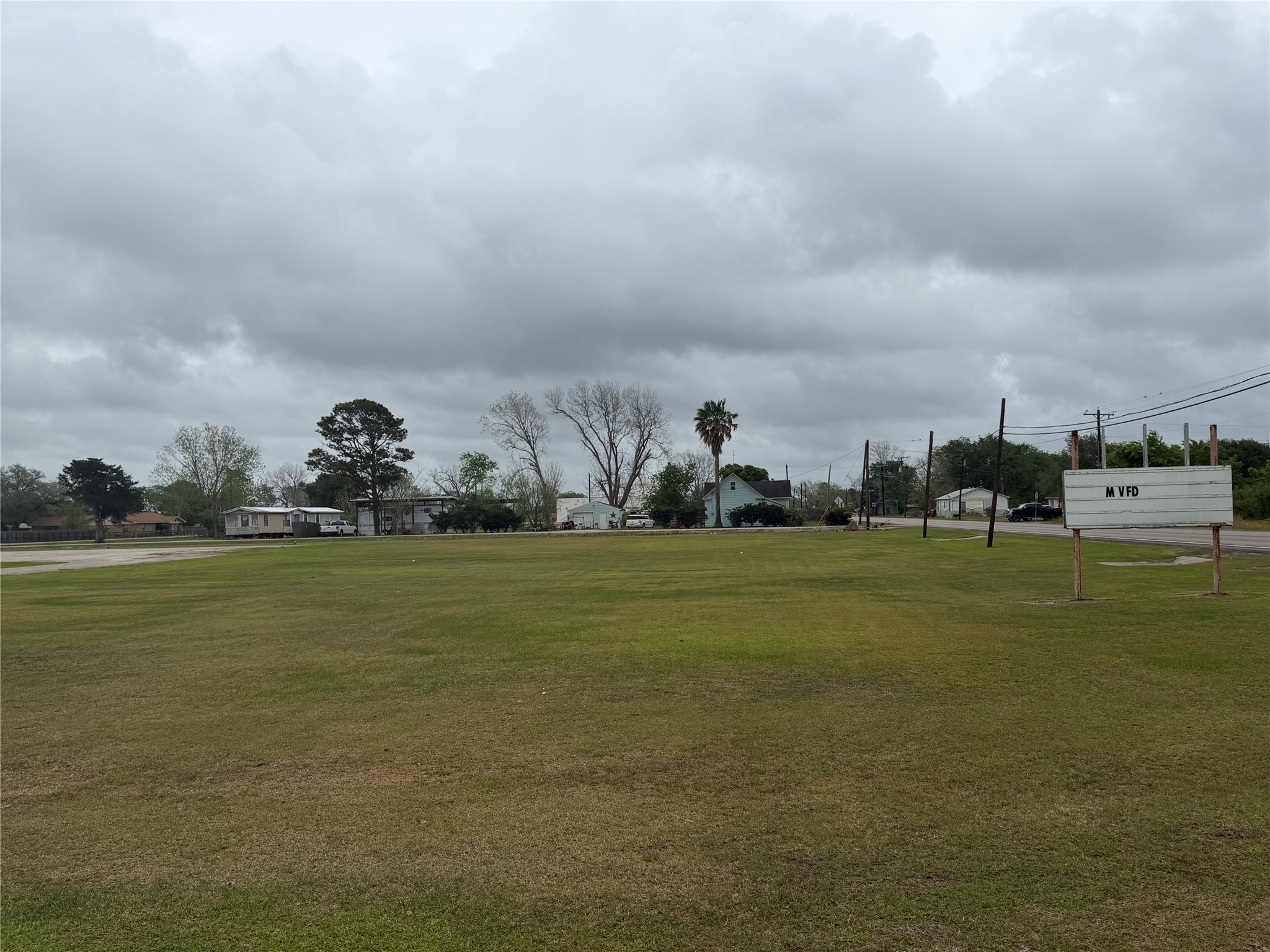Lot 11-14 3rd Street Midfield, TX 77458 - Photo 8 of 8 a view of a lake and houses with outdoor space