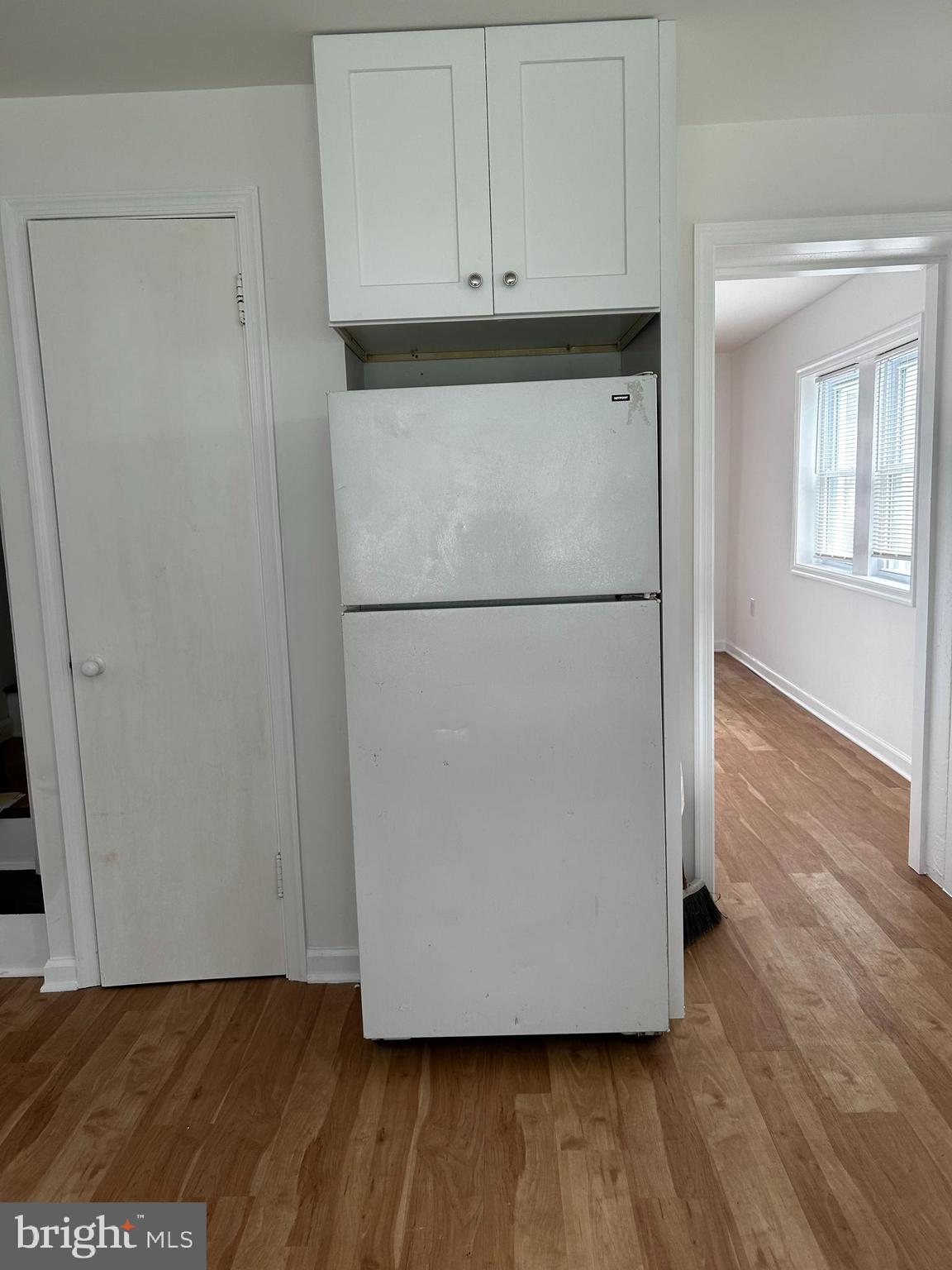 114 Center Street Bridgeport, PA 19405 - Photo 11 of 16 a view of a refrigerator in kitchen and wooden floor