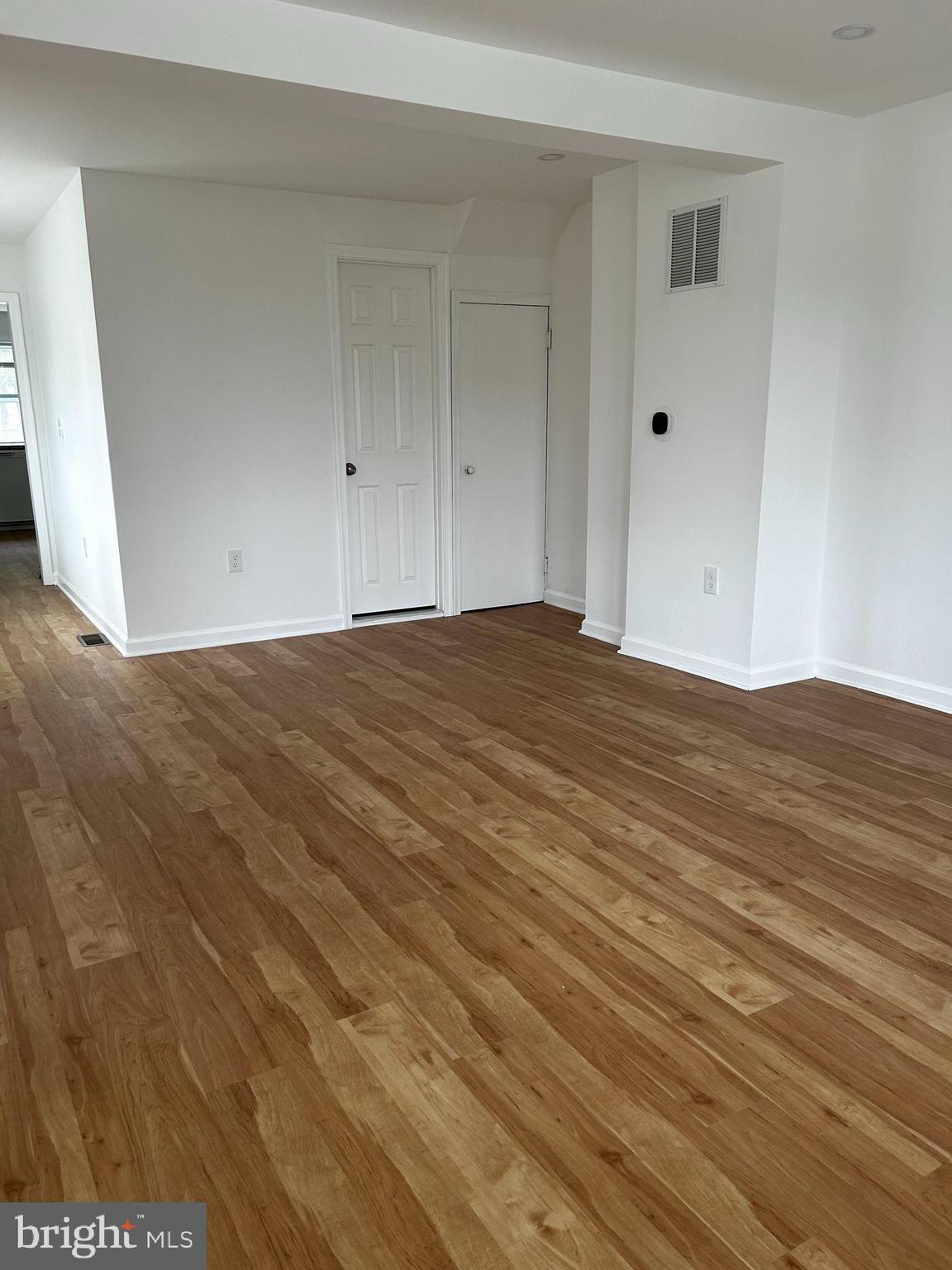 114 Center Street Bridgeport, PA 19405 - Photo 5 of 16 a view of an empty room with wooden floor