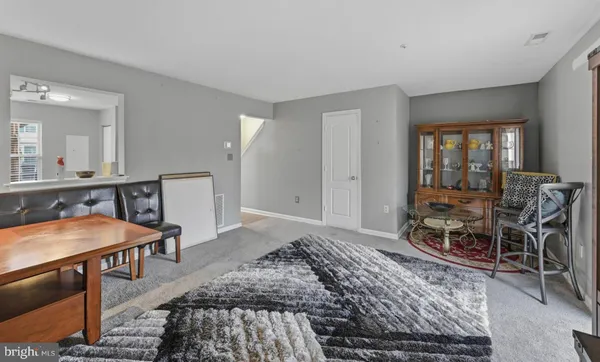 a bedroom with furniture and a wooden floor