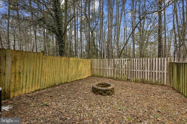 a view of a backyard with a fence