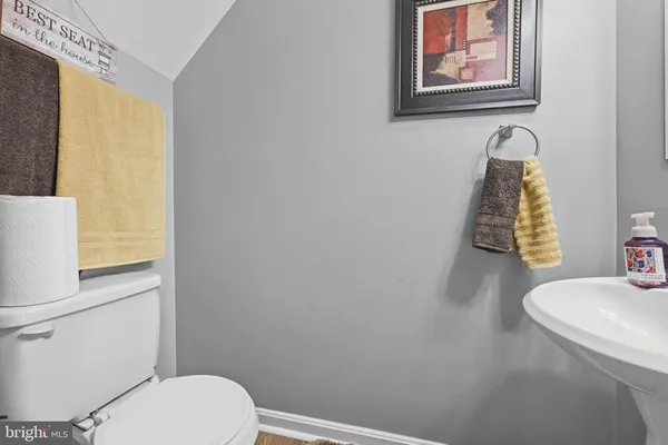 a bathroom with a toilet and a sink