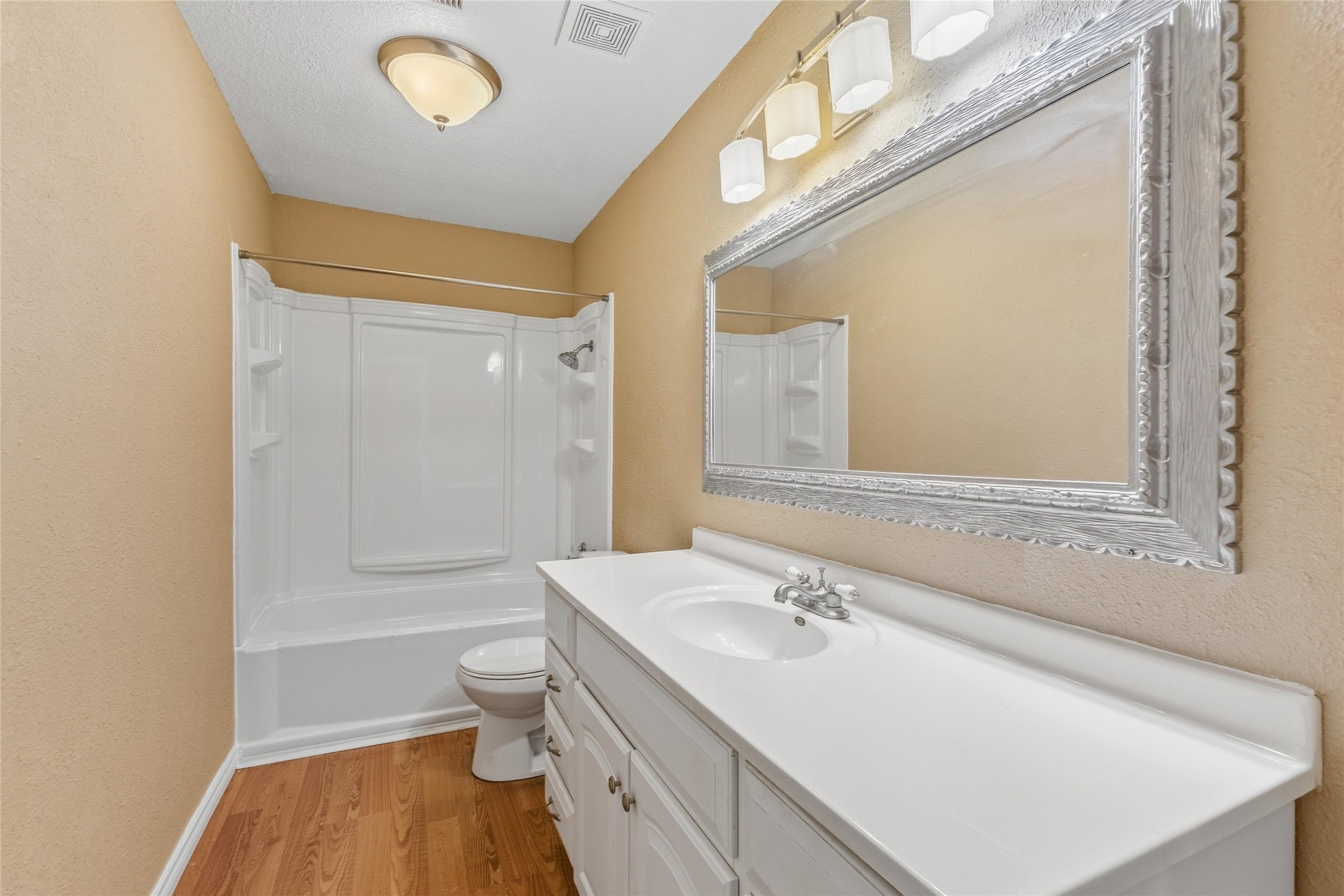 340 Warner Street Bridge City, TX 77611 - Photo 12 of 15 a bathroom with a sink a toilet and shower
