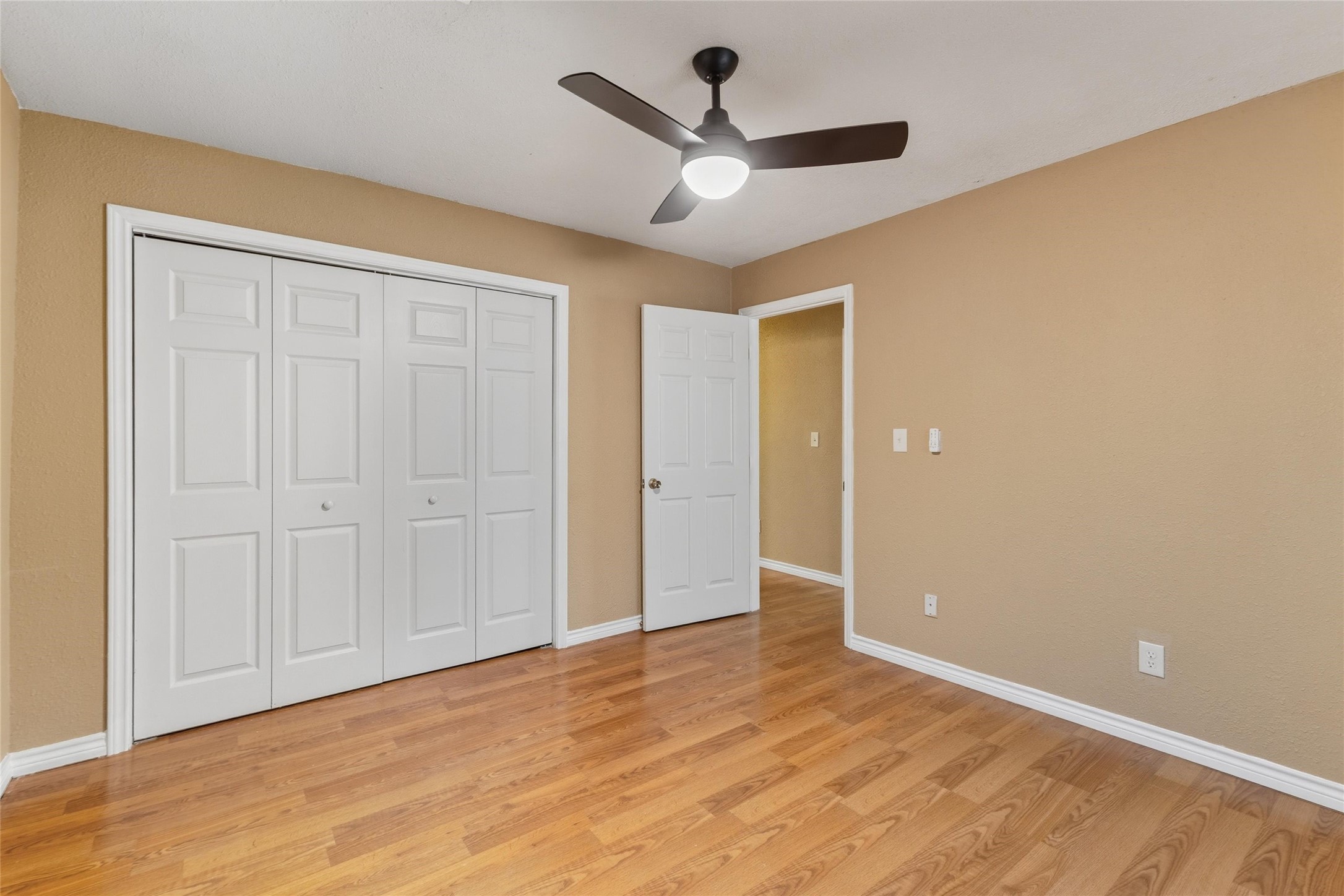 340 Warner Street Bridge City, TX 77611 - Photo 15 of 15 a view of a livingroom with a ceiling fan & wooden floor