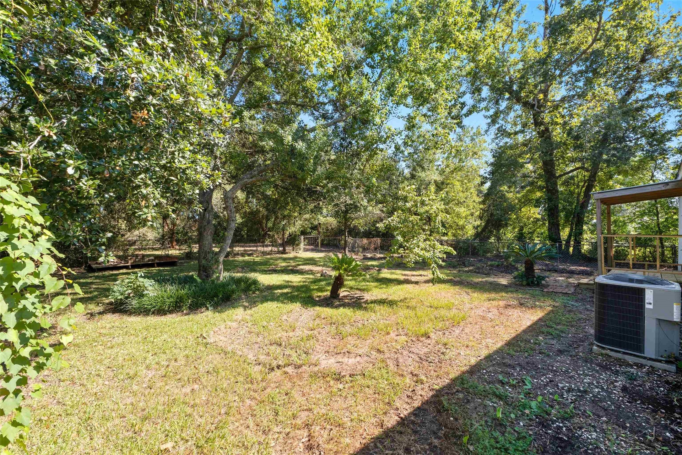 340 Warner Street Bridge City, TX 77611 - Photo 4 of 15 a view of a backyard with large trees