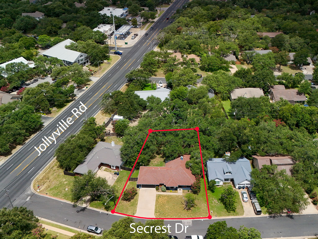5842 Secrest Drive Austin, TX 78759 - Photo 34 of 40 An aerial perspective showcases a generously treed lot with direct road access, offering privacy and natural beauty.