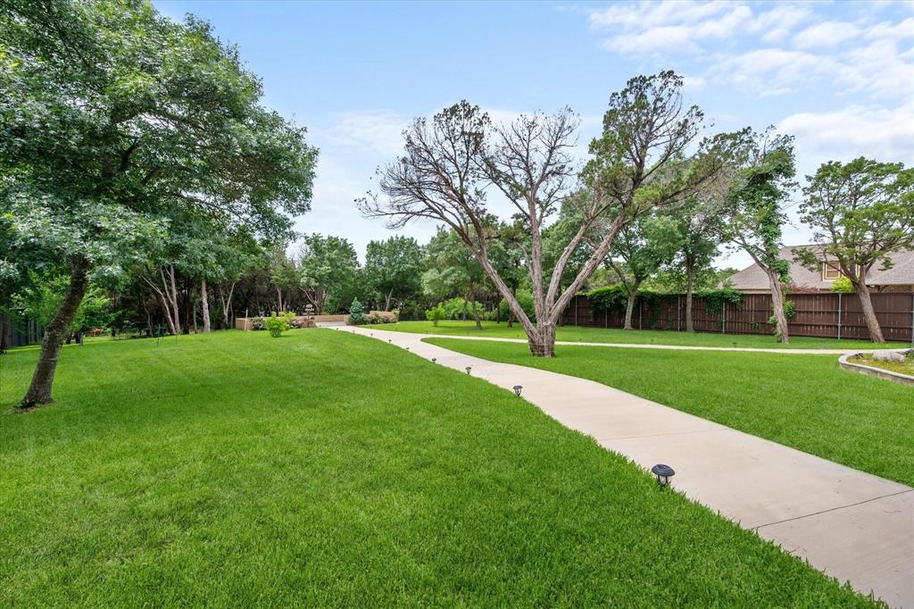 2314 Sunset Ridge Circle Cedar Hill, TX 75104 - Photo 37 of 40 This large backyard offers endless possibilities - you could even put in a pickle ball or tennis court if desired!