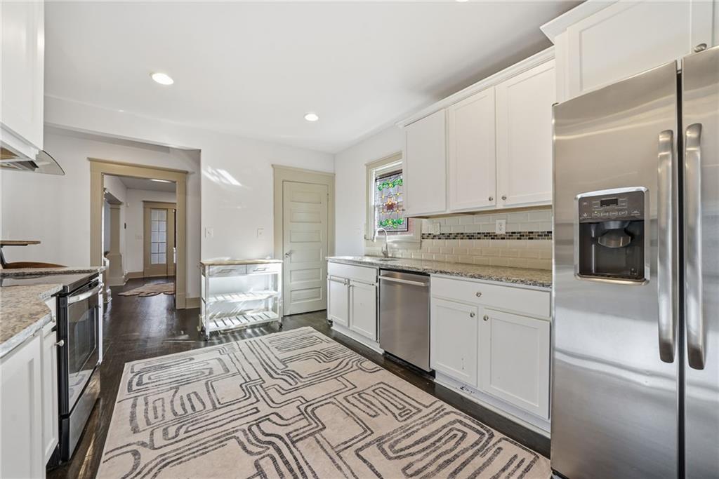 1530 South Gordon Street Southwest Atlanta, GA 30310 - Photo 19 of 46 a kitchen with a sink stove and refrigerator
