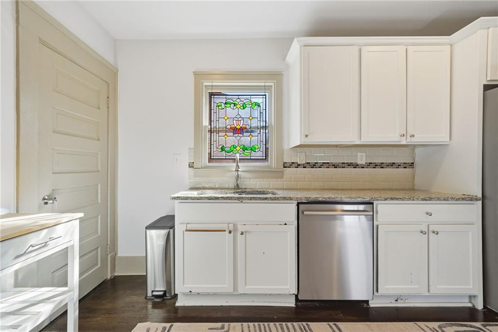 1530 South Gordon Street Southwest Atlanta, GA 30310 - Photo 20 of 46 a kitchen with granite countertop white cabinets and white appliances