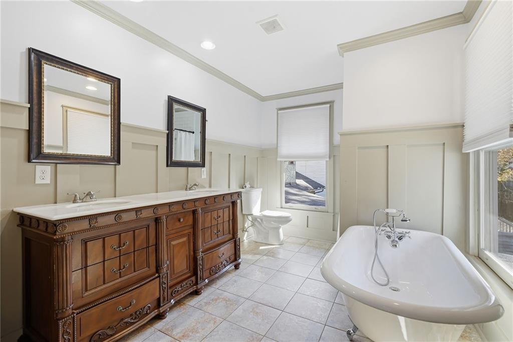 1530 South Gordon Street Southwest Atlanta, GA 30310 - Photo 30 of 46 a spacious bathroom with a double vanity sink mirror and bathtub