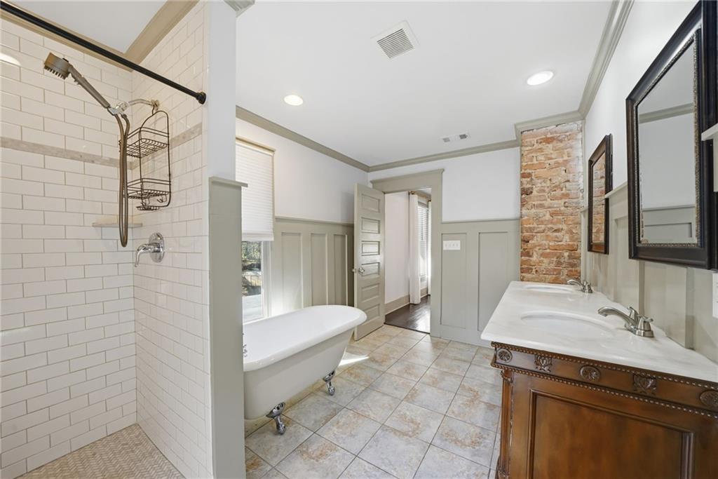 1530 South Gordon Street Southwest Atlanta, GA 30310 - Photo 32 of 46 a bathroom with a granite countertop sink a toilet and shower