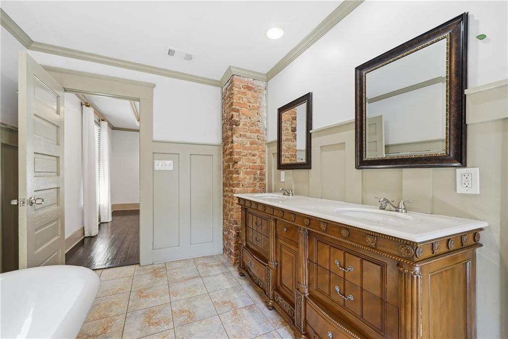 1530 South Gordon Street Southwest Atlanta, GA 30310 - Photo 33 of 46 a spacious bathroom with a double vanity sink and a mirror