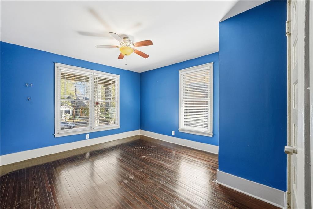 1530 South Gordon Street Southwest Atlanta, GA 30310 - Photo 34 of 46 a view of an empty room with a window and wooden floor