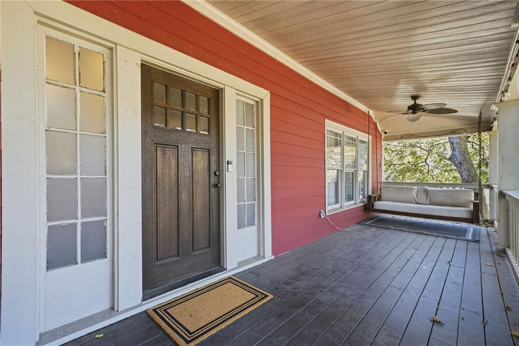 1530 South Gordon Street Southwest Atlanta, GA 30310 - Photo 6 of 46 a view of an empty room with wooden floor and a window