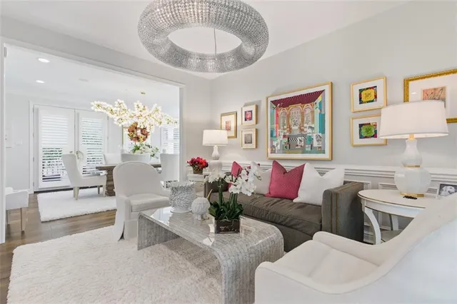 a living room with furniture and flowers