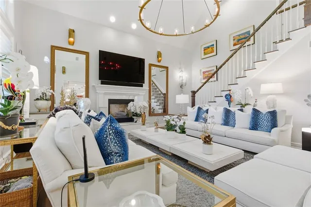 a living room with fireplace furniture and a flat screen tv