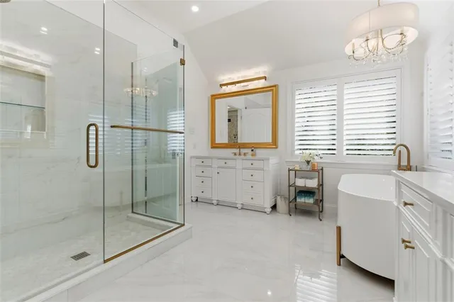 a bedroom with a bed tv and flat screen tv