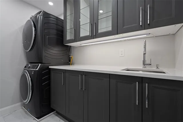 a bathroom with a shower sink double vanity and mirror