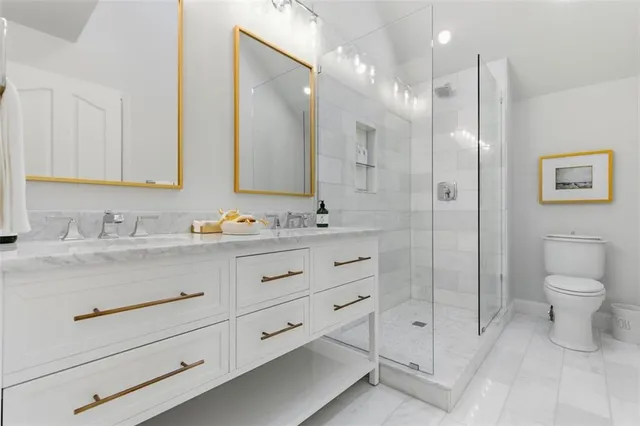 a living room with furniture a flat screen tv and a window