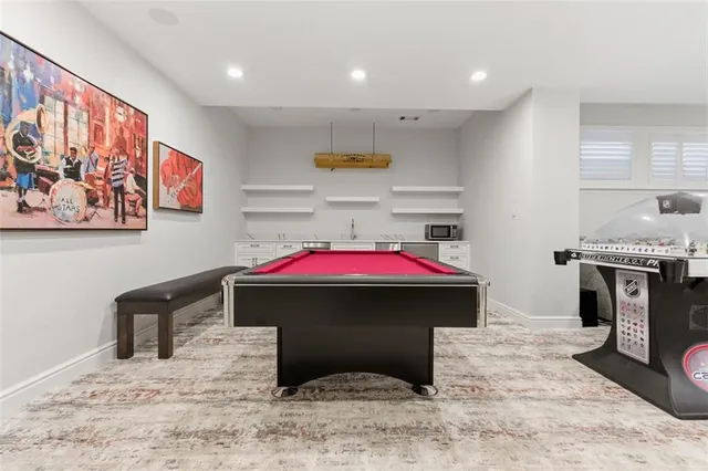 a bedroom with furniture and a wooden floor