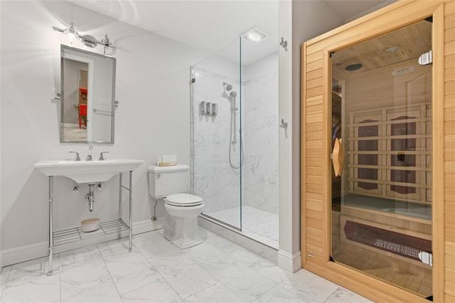 a view of a patio with table and chairs and potted plants