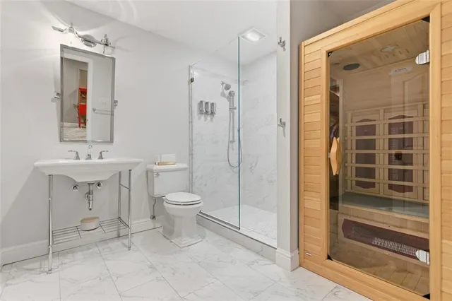 a view of a patio with table and chairs and potted plants