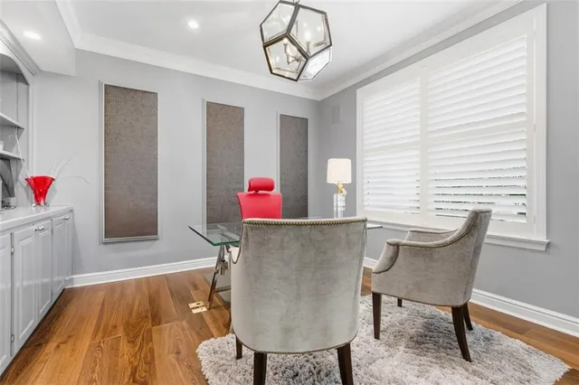 a view of dining room with furniture and wooden floor