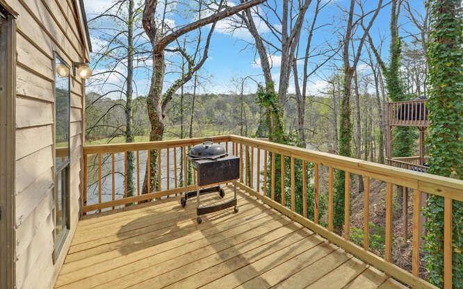 390 Colony Cove Alpharetta, GA 30022 - Photo 11 of 41 a view of a balcony with wooden floor and fence
