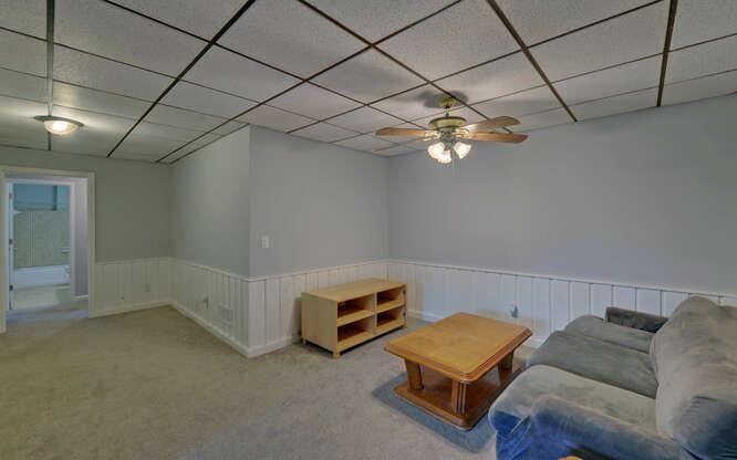 390 Colony Cove Alpharetta, GA 30022 - Photo 27 of 41 a room with furniture and a chandelier fan