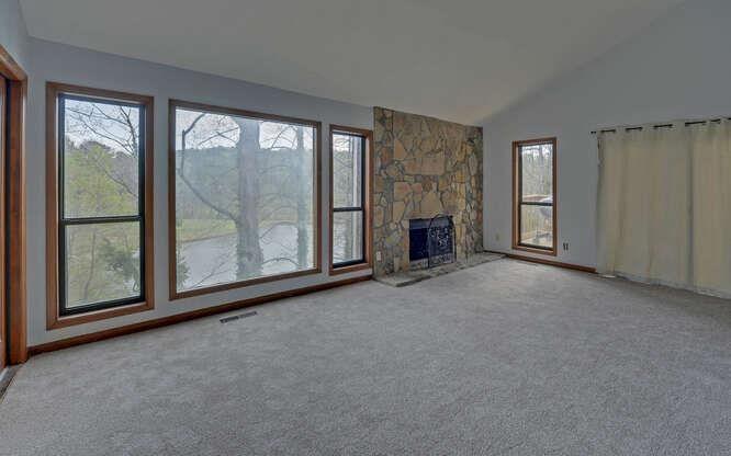 390 Colony Cove Alpharetta, GA 30022 - Photo 6 of 41 an empty room with windows lake and mountain view