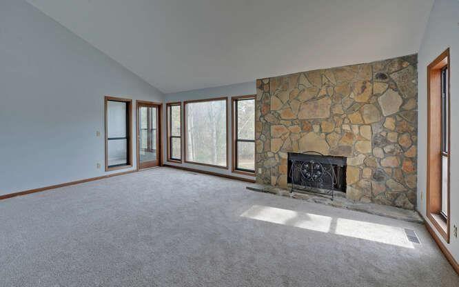 390 Colony Cove Alpharetta, GA 30022 - Photo 7 of 41 a view of an empty room with a fireplace and a window