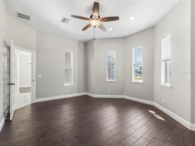 a kitchen with stainless steel appliances granite countertop a stove a microwave a sink and a granite counter tops