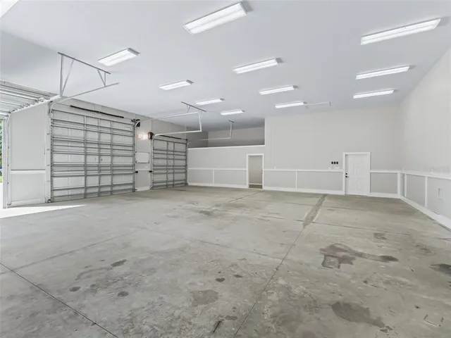 a view of an empty room and wooden floor