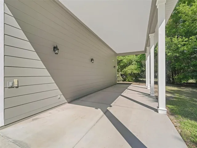 a terrace of a house with outdoor seating
