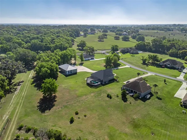 a view of a garden with sitting area