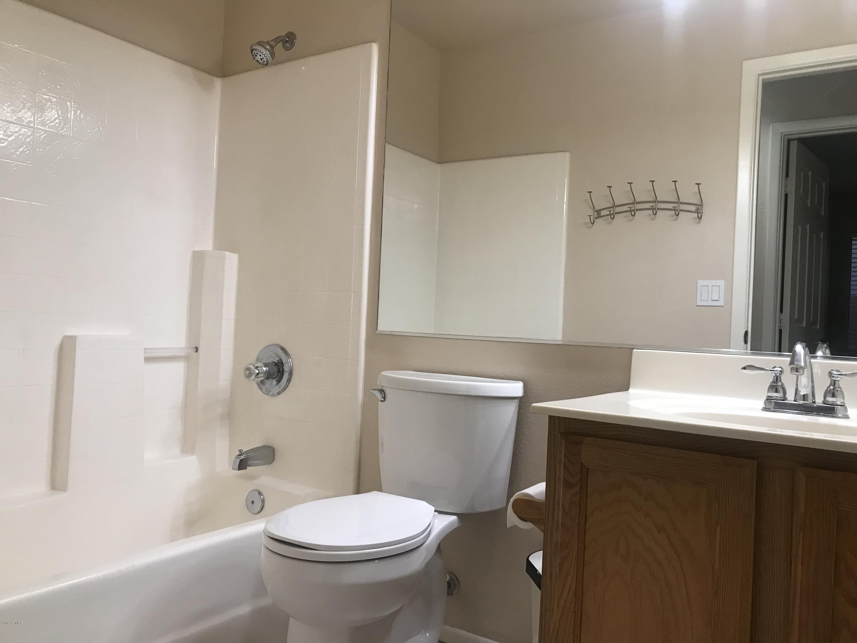 4133 West Bloomfield Road Phoenix, AZ 85029 - Photo 11 of 27 a bathroom with a sink toilet and shower