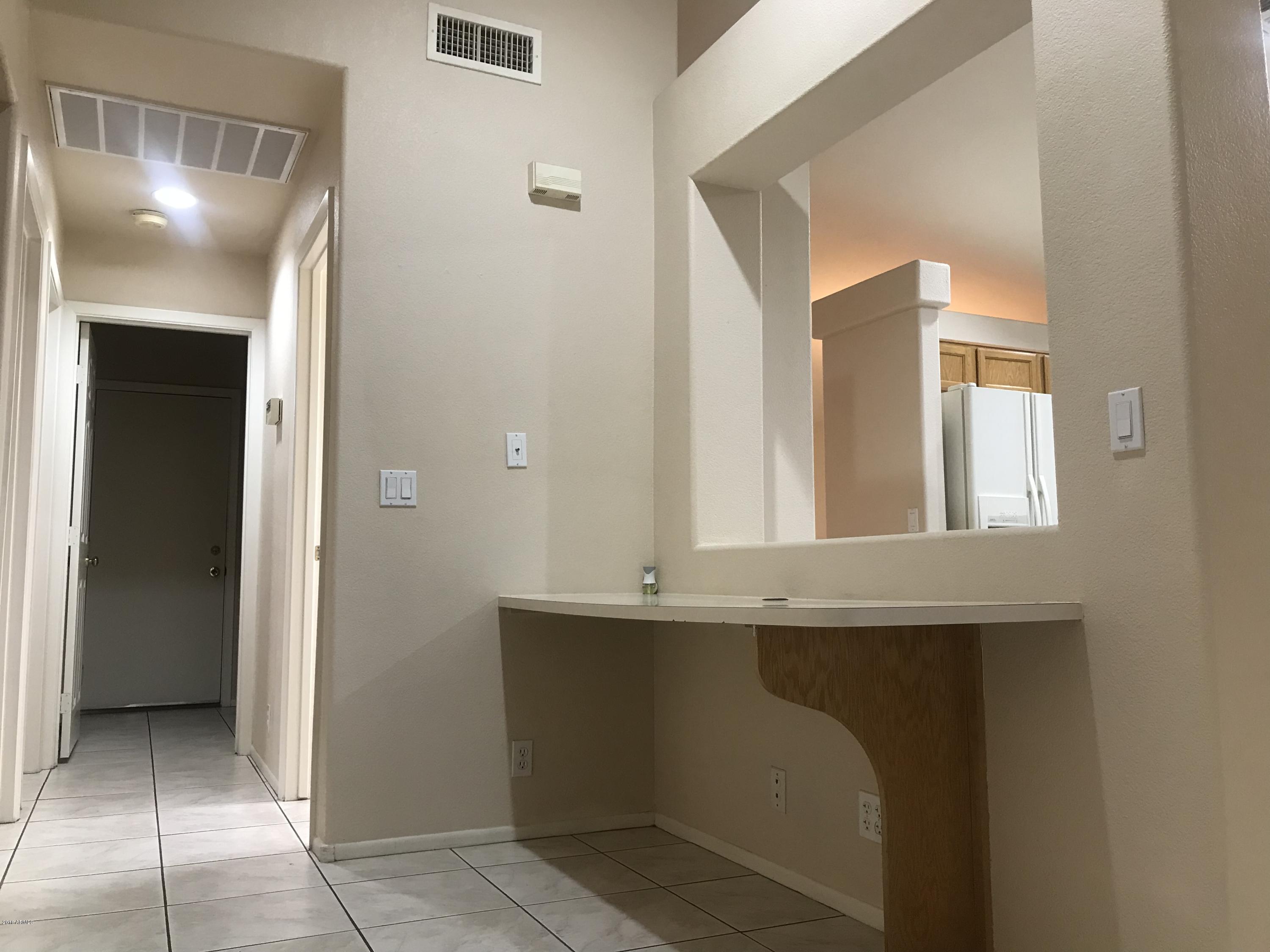4133 West Bloomfield Road Phoenix, AZ 85029 - Photo 18 of 27 a bathroom with a sink and a mirror