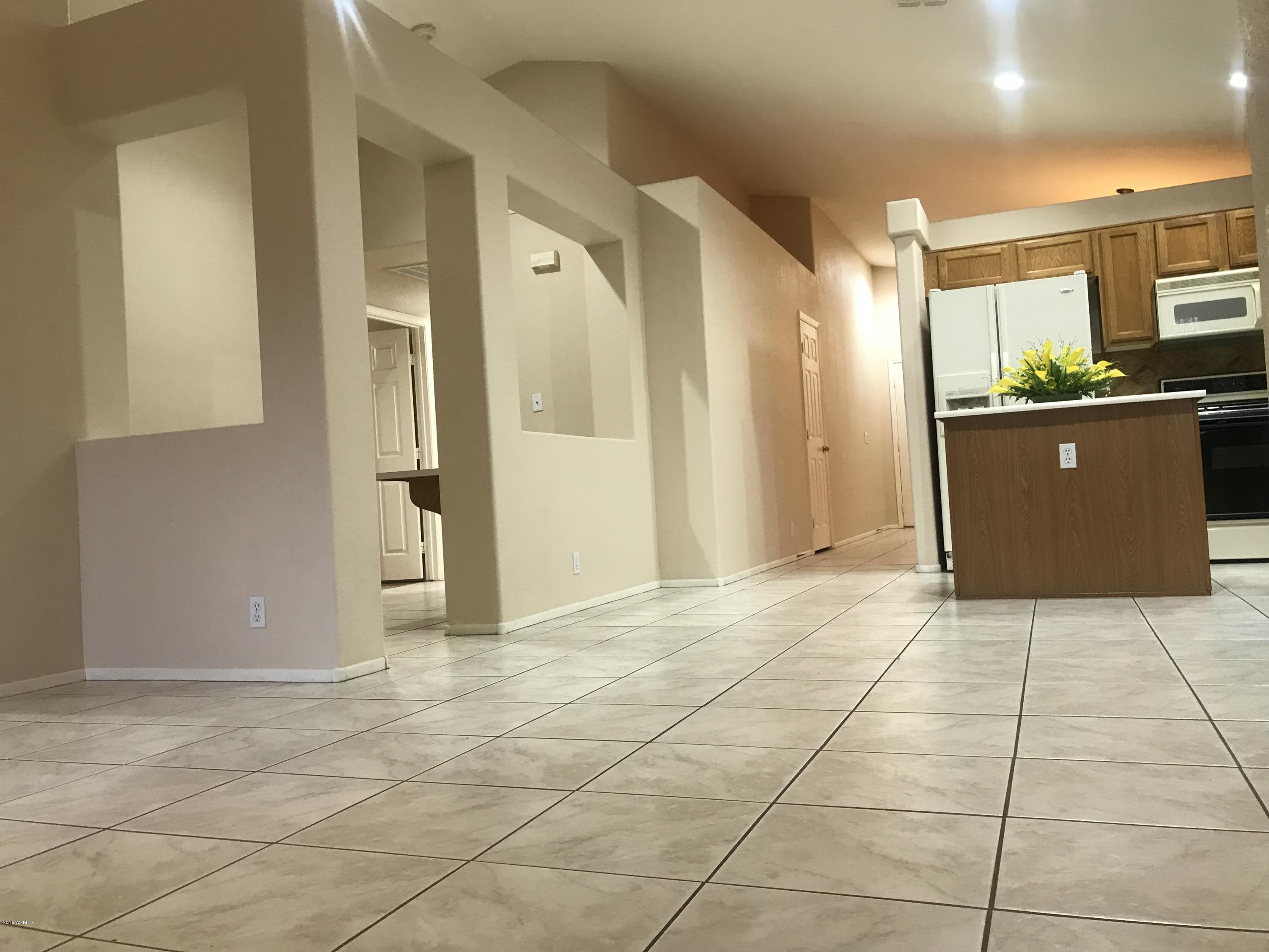 4133 West Bloomfield Road Phoenix, AZ 85029 - Photo 24 of 27 a view of a livingroom with kitchen