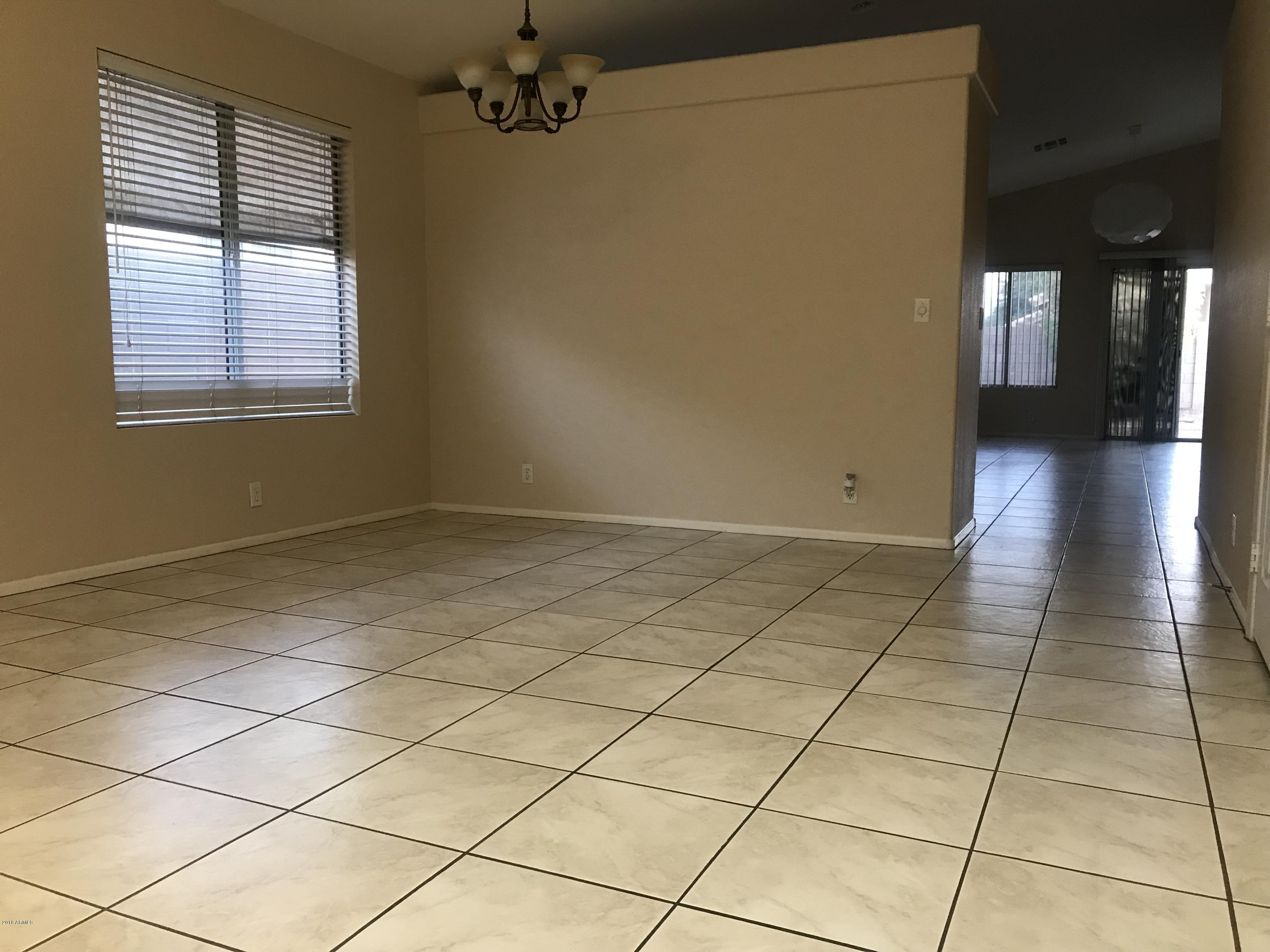 4133 West Bloomfield Road Phoenix, AZ 85029 - Photo 4 of 27 a view of an empty room and a window