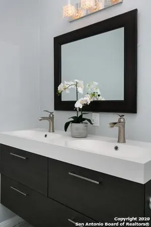 a bathroom with a sink and a mirror