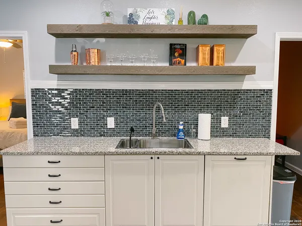 a kitchen with a sink and cabinets