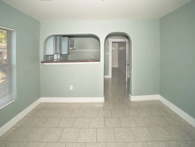 a kitchen with stainless steel appliances granite countertop a sink and a stove