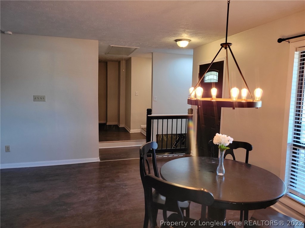 513 Andover Road Fayetteville, NC 28311 - Photo 12 of 21 a dining room with furniture and wooden floor