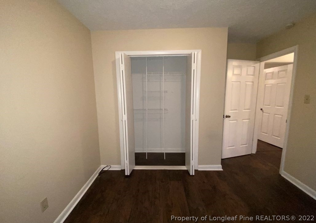 513 Andover Road Fayetteville, NC 28311 - Photo 15 of 21 an empty room with wooden floor and closet