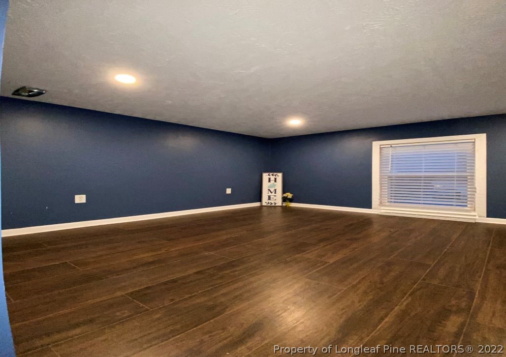 513 Andover Road Fayetteville, NC 28311 - Photo 19 of 21 a view of empty room with wooden floor