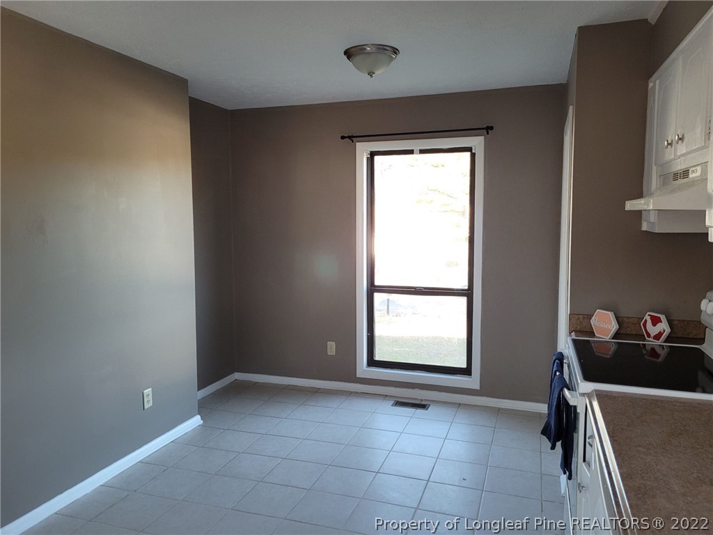 513 Andover Road Fayetteville, NC 28311 - Photo 9 of 21 a view of an empty room and window